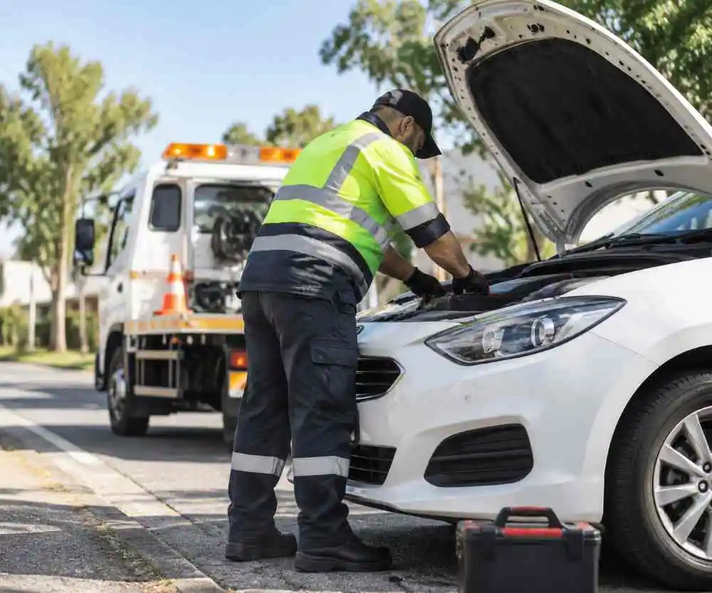 Roadside Technician Repairing a Car
